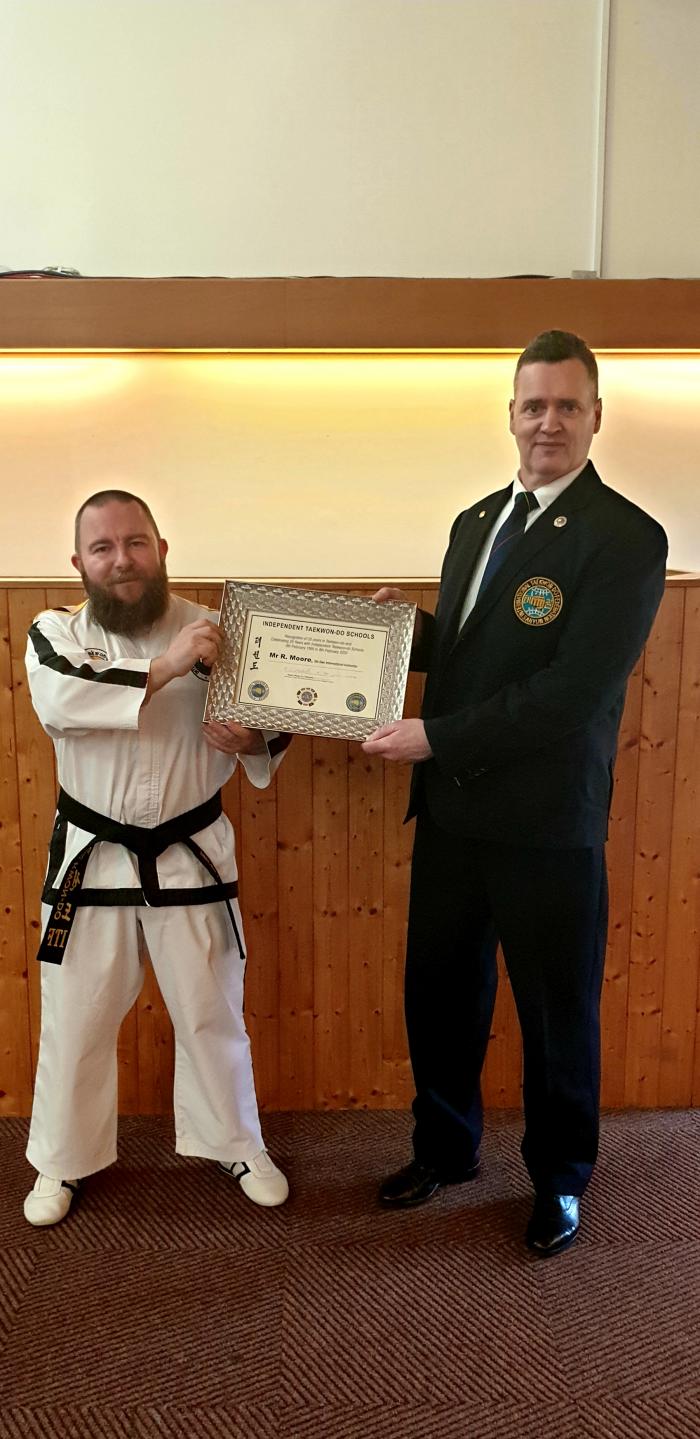 Receiving a commemorative certificate from my instructor Master Murdoch celebrating 25 years of training with the club.